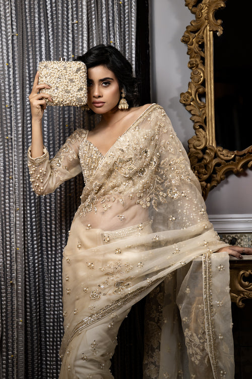 Elegant Golden embellished saree with intricate beadwork and Saree